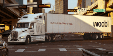 Autonomous Waabi self-driving truck operating on an urban roadway, highlighting AI-powered freight transportation technology.