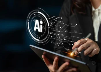 Professional using a tablet with a digital AI interface overlay, representing artificial intelligence, data security, and enterprise technology.