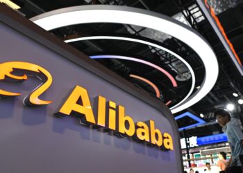 Alibaba logo displayed at a technology event, representing the company’s expansion and innovation in artificial intelligence and cloud computing.